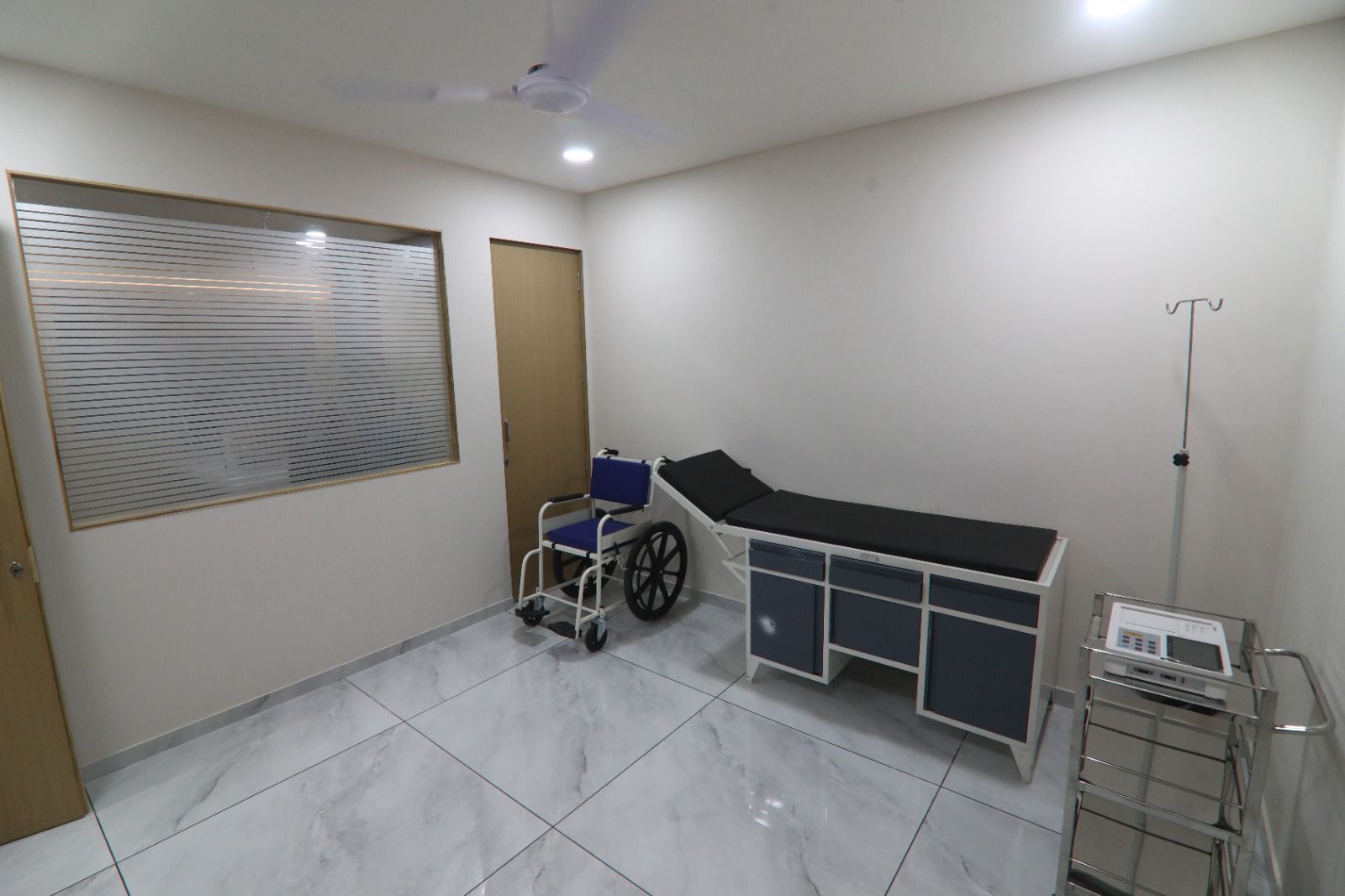 Examination room with wheelchair and IV stand